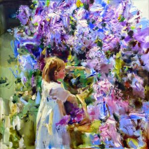 woman in the garden with lilacs
