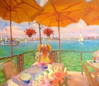 girl sitting at the table Beneath the Yellow Umbrellas