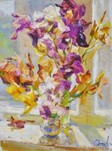purple and orange irises in a vase