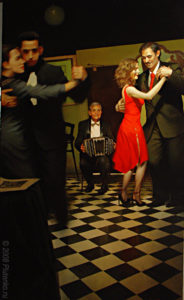 couple dancing, woman in red, lady in red, man playing accordion