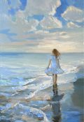 girl walking down the beach