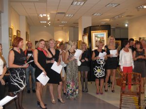 women singing in art gallery