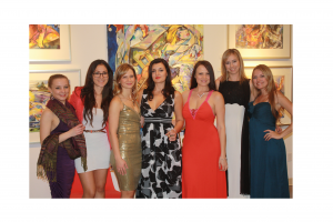 women in gowns in art gallery