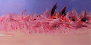 group of pink flamingos flying