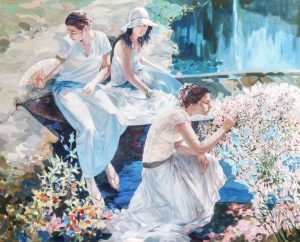 women in a garden by a lake