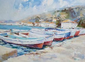 white and red boats on the shore