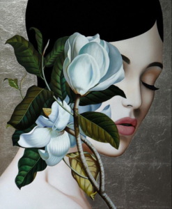 profile of woman with magnolia flower