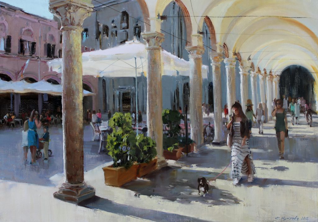 woman walking in Italian sunlit piazza
