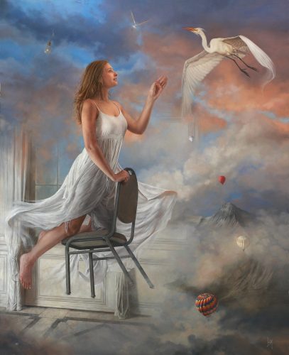 girl floating on a chair touching a bird