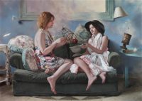 two girls playing on a sofa