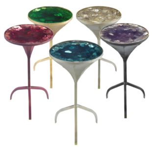 Martini Table <br />
21.5”H x 12”W<br />
The most sought-after piece in the collection is this round mini conversation piece, fashioned from solid steel into a charming martini glass form. Champagne gold fragments ¬oat to the surface displaying movement in the depths of 8” resin. Finishing with customizable, playful multi-colored tones.<br />
