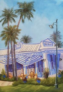blue and white striped restaurant and palms