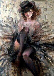 woman in tule skirt and black hat