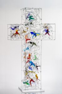 glass cross with figures inside