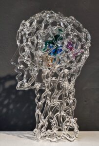 glass head with figures inside