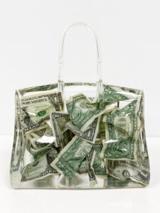 clear bag with dollars inside