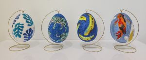 Grouping of paper mache egg sculptures with acrylic and 10,000 crystals