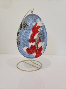 blue egg with coy fish